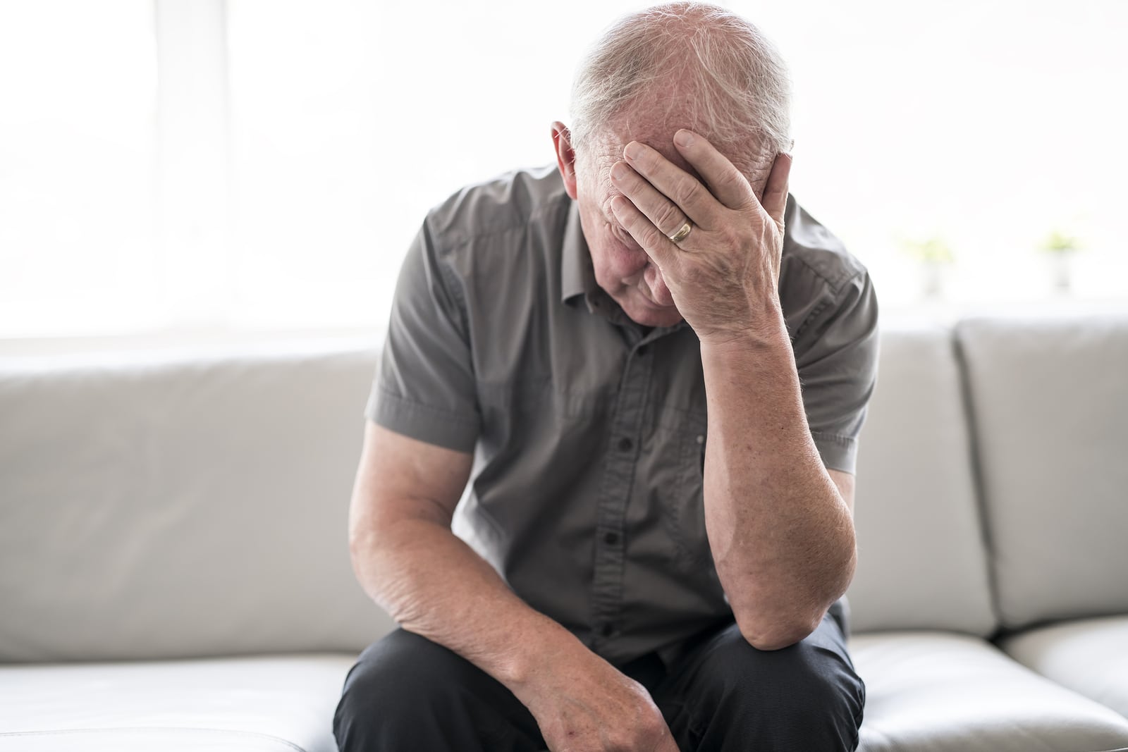 Senior Man Thinking And Sitting On Sofa At Home Like Sad protection seniors wealth image